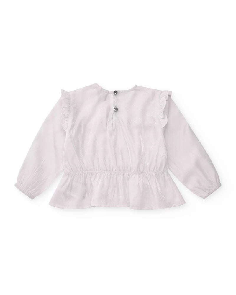 Blusa a maniche lunghe per bambina bianca con dettaglio di volant.