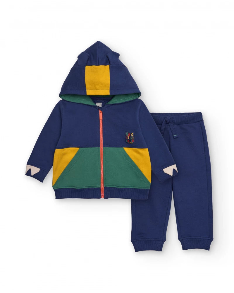 Completo sportivo per bambino blu navy con dettagli verdi e gialli.
