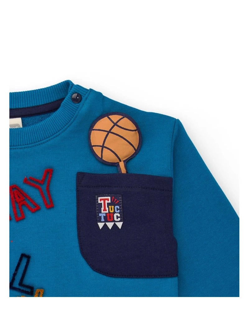 Completo felpa e pantalone per bambino in blu con stampa e ricami.