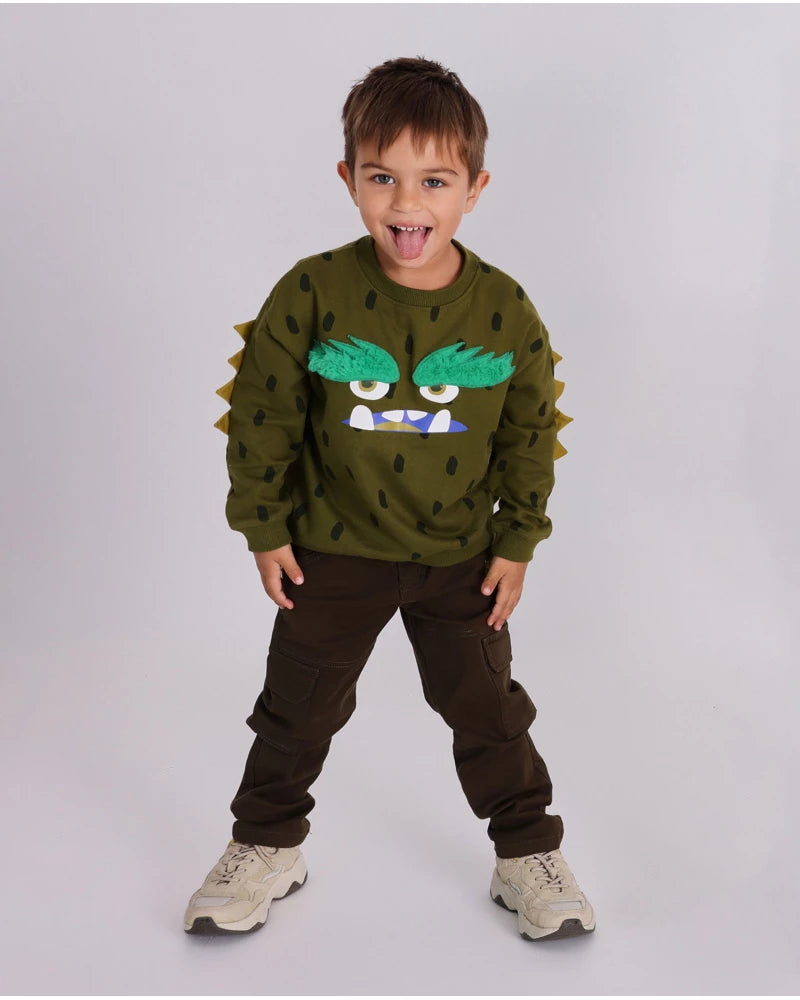 Felpa per bambino verde con stampa di mostro e dettagli in rilievo.