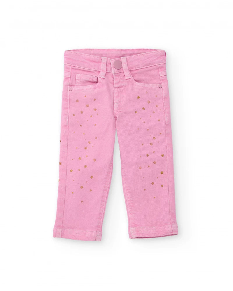 Pantaloni lunghi in twill stretch per bambina colore rosa con stampa di stelline dorate.