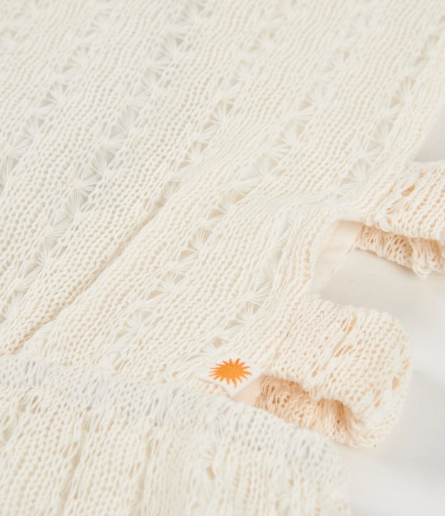 Tuta da bambina in maglia con aperture laterali