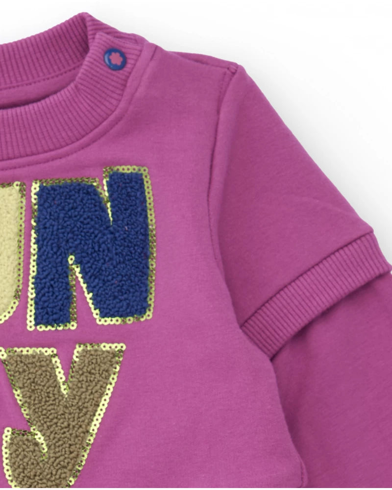 Vestito in felpa per bambina colore magenta con gonna in tulle stampato.